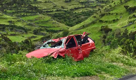 Red color car accident around mountain